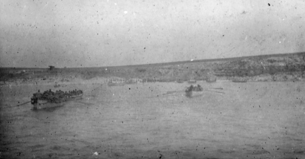 The first boatloads of men of 1st Battalion, Lancashire Fusiliers landing at W Beach